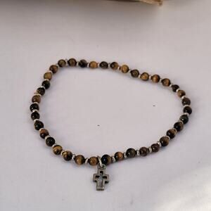 Vintage tiger's eye bracelet with silver tone cross charm 1990s stretch